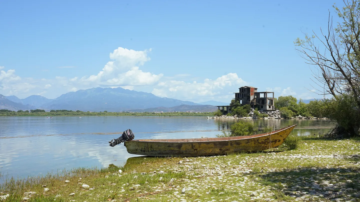 A boat on the shore of Lake Skadar in Albania